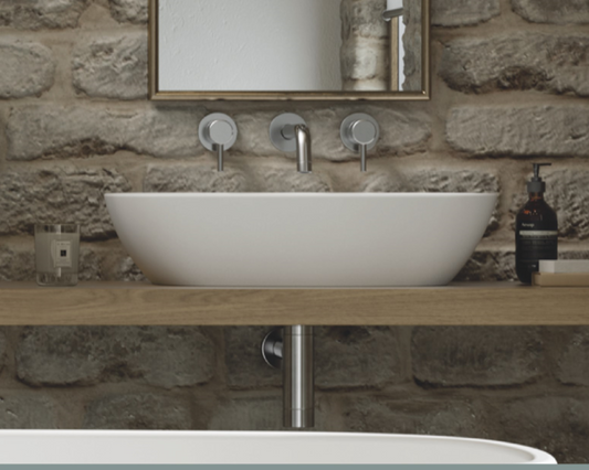 This stone basin is a stunning addition to any modern or contemporary bathroom. This luxurious basin is expertly crafted from natural volcanic limestone and high quality resin, creating a strong and durable surface that is resistant to scratches and chipping. The basin features graceful curves and smooth lines, creating an elegant and sophisticated look that complements the accompanying bathtub perfectly.