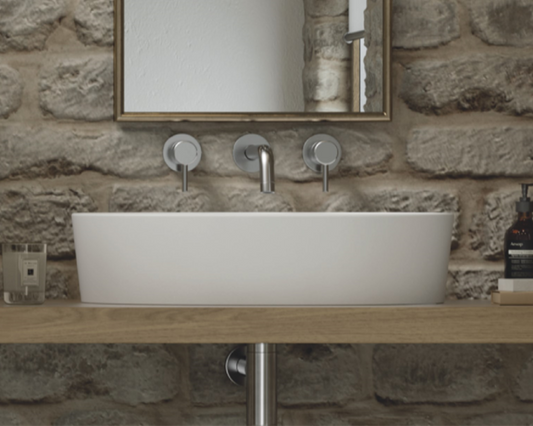The Oval shaped basin is a sleek and modern addition to any bathroom. Expertly crafted from natural volcanic limestone and high quality resin, this basin boasts durability, strength, and resistance to scratches and chips. Its clean lines and minimalistic design create a sophisticated and chic look that is perfect for modern or contemporary bathrooms.
