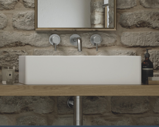 The rectangular shaped basin is a sleek and modern addition to any bathroom. Expertly crafted from natural volcanic limestone and high quality resin, this basin boasts durability, strength, and resistance to scratches and chips. Its clean lines and minimalistic design create a sophisticated and chic look that is perfect for modern or contemporary bathrooms.